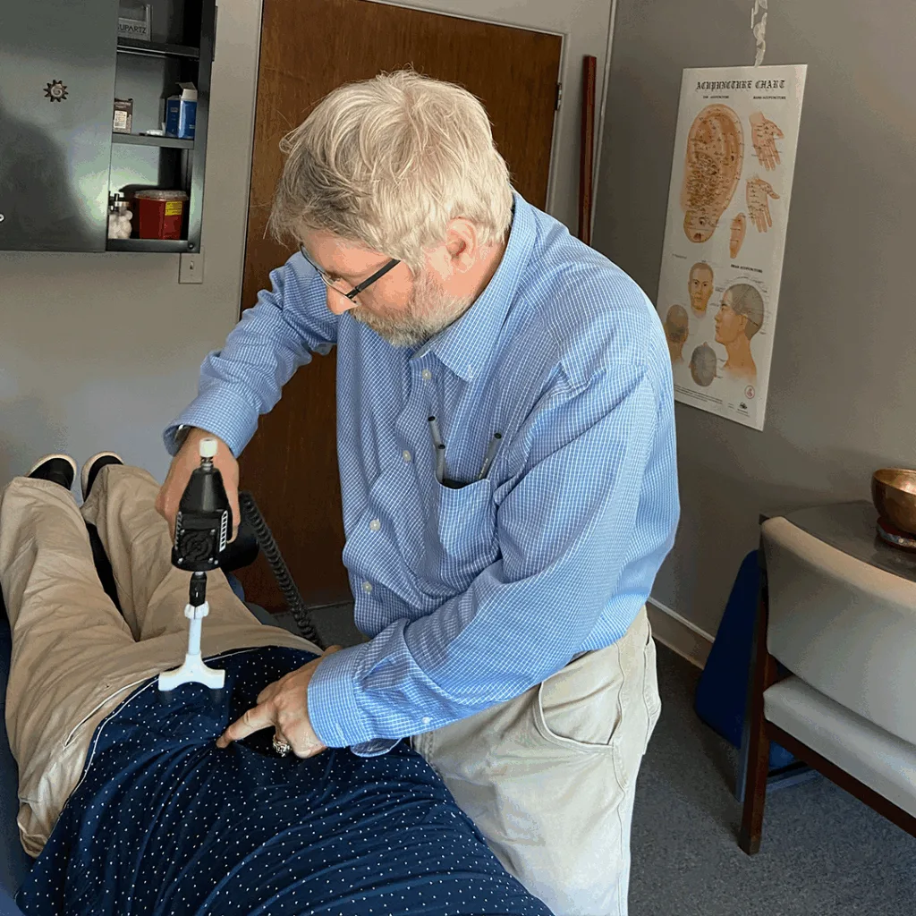Dr. Paul Rieselman performing an Activator Method treatment